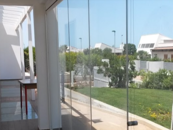 Archisio - Glass Center Mola - Progetto Parete in vetro